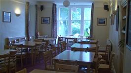 The dining room at Buttermere Youth Hostel, with water dripping down from the burst pipe above